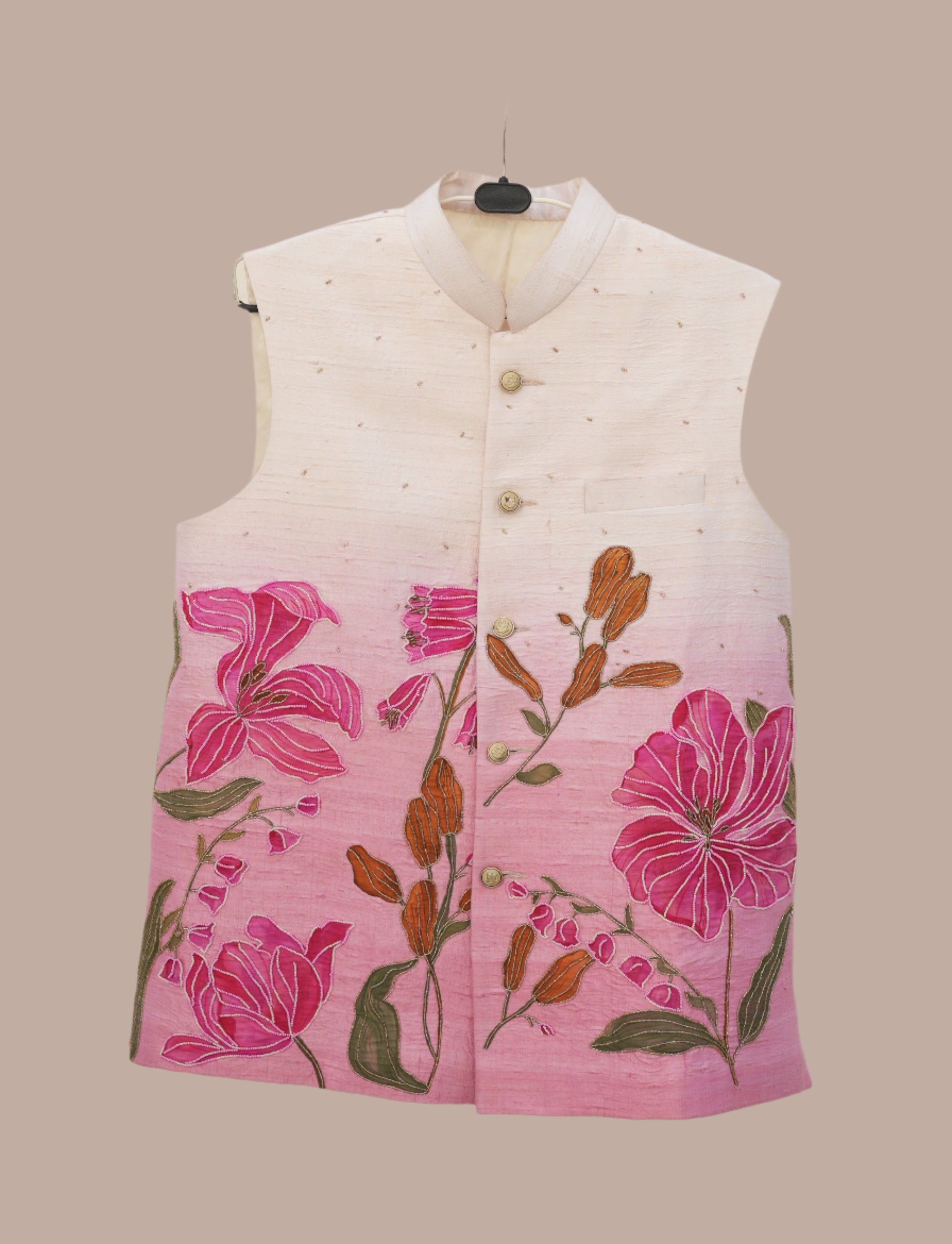 White nehru jacket with had painted pink floral design on a beige background