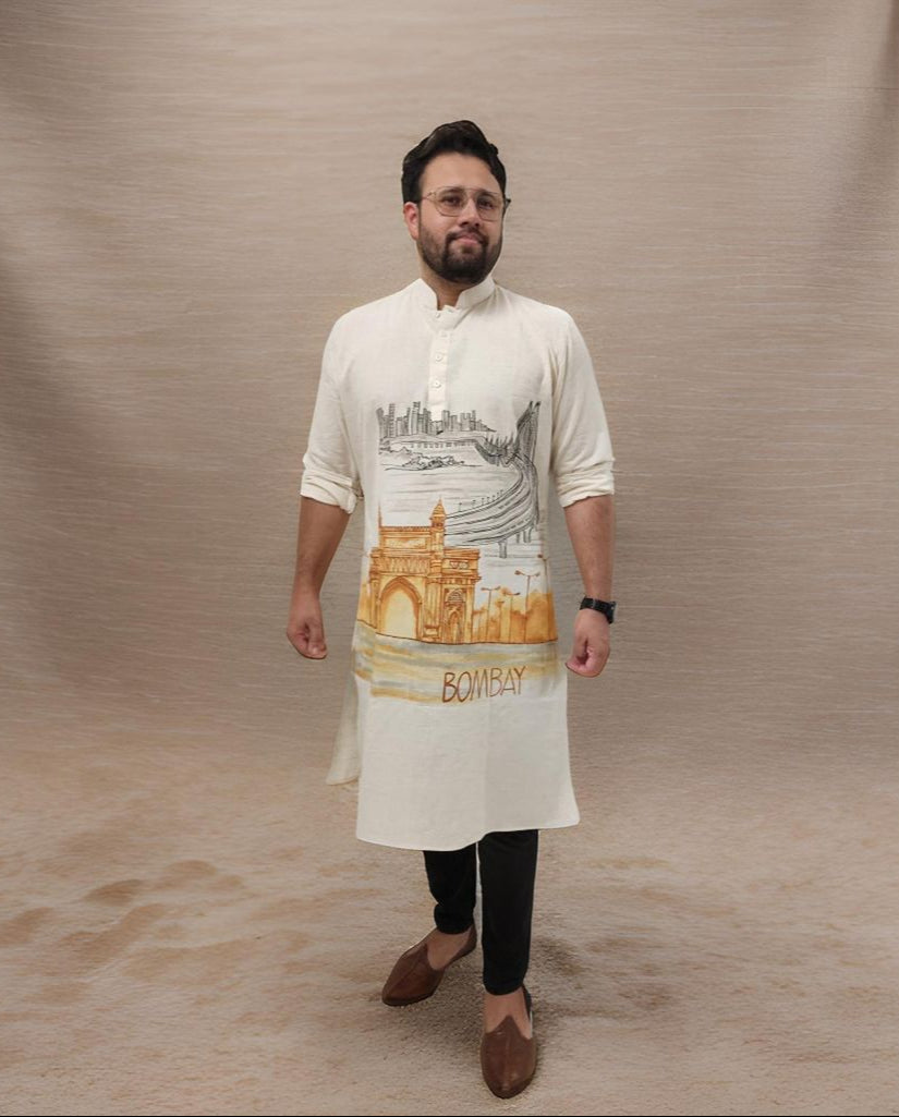 Man wearing a kurta with a design and text on a beige background