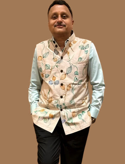 Man wearing a hand painted over a light green shirt on a black pant 